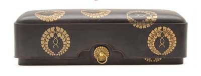 A japanese laquer box and cover adroned with gilt roundels on Brown Ground,twin metal ring handels.Meiji 1868-1913, A few minor chips